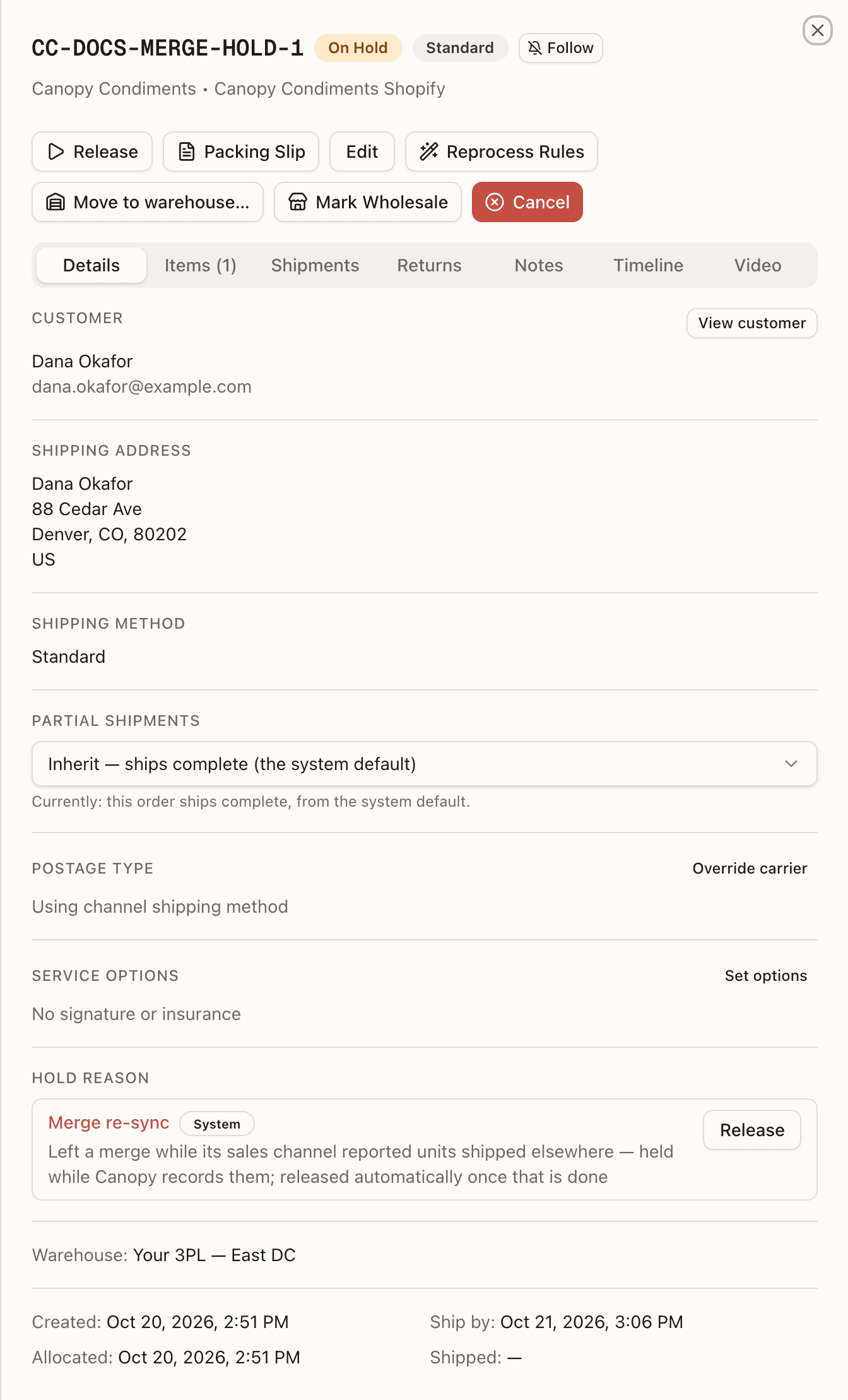 An order just taken out of a merge — On Hold, System, with the re-sync hold reason