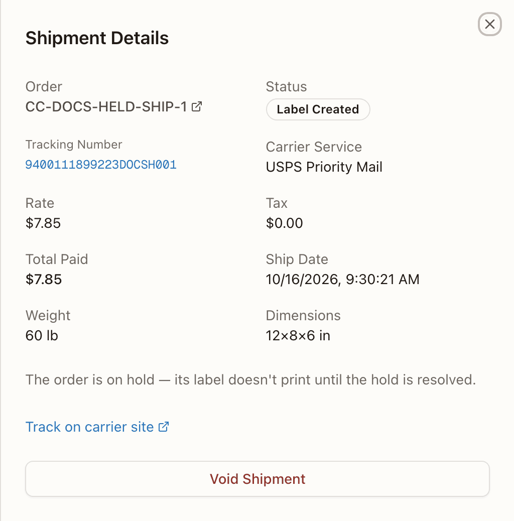 A held order's Shipment Details: the held-label note in place of Download Label and Reprint Label