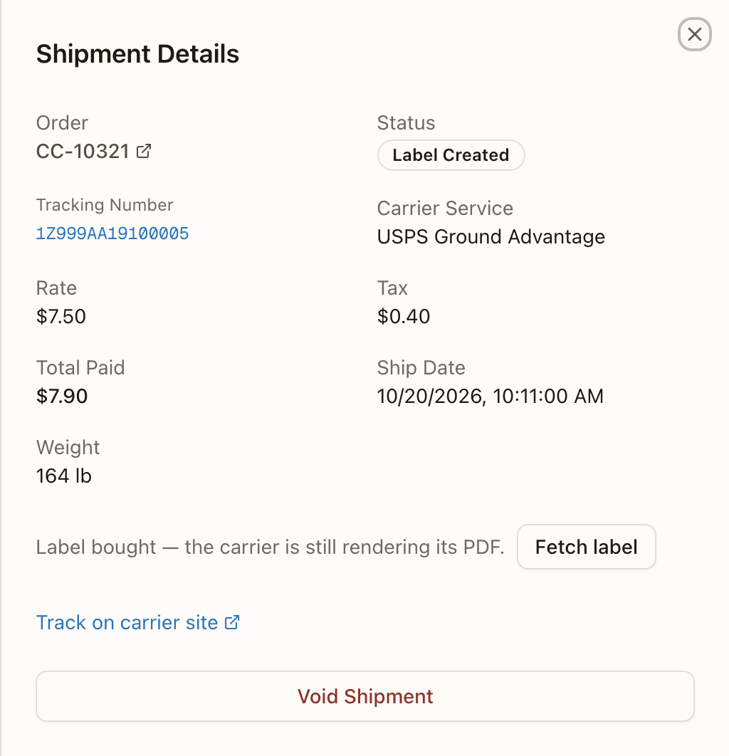 A shipment whose label document is still rendering — the pending line and Fetch label in place of the download buttons