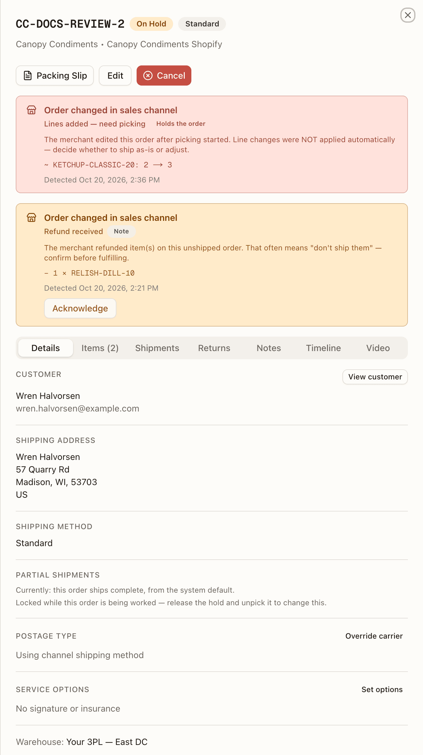 Two review cards above the tabs of CC-DOCS-REVIEW-2: a red Order changed in sales channel card wearing Holds the order with KETCHUP-CLASSIC-20: 2 → 3, and under it an amber card wearing Note for a refund, with an Acknowledge button