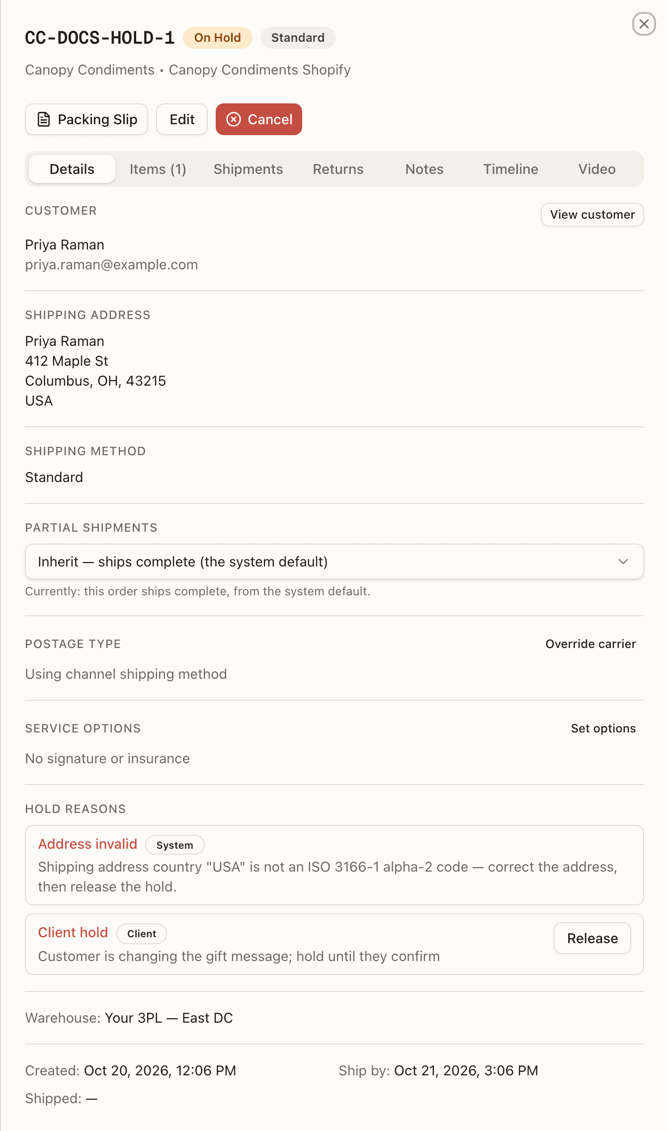 The hold list on your order's Details tab: the System's Address invalid hold with no button, above your own Client hold with its Release button