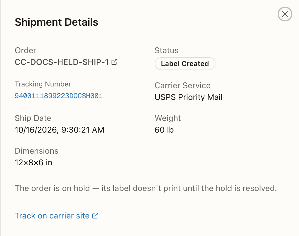 A held order's shipment detail: the held-label note in place of Download Label and Reprint Label